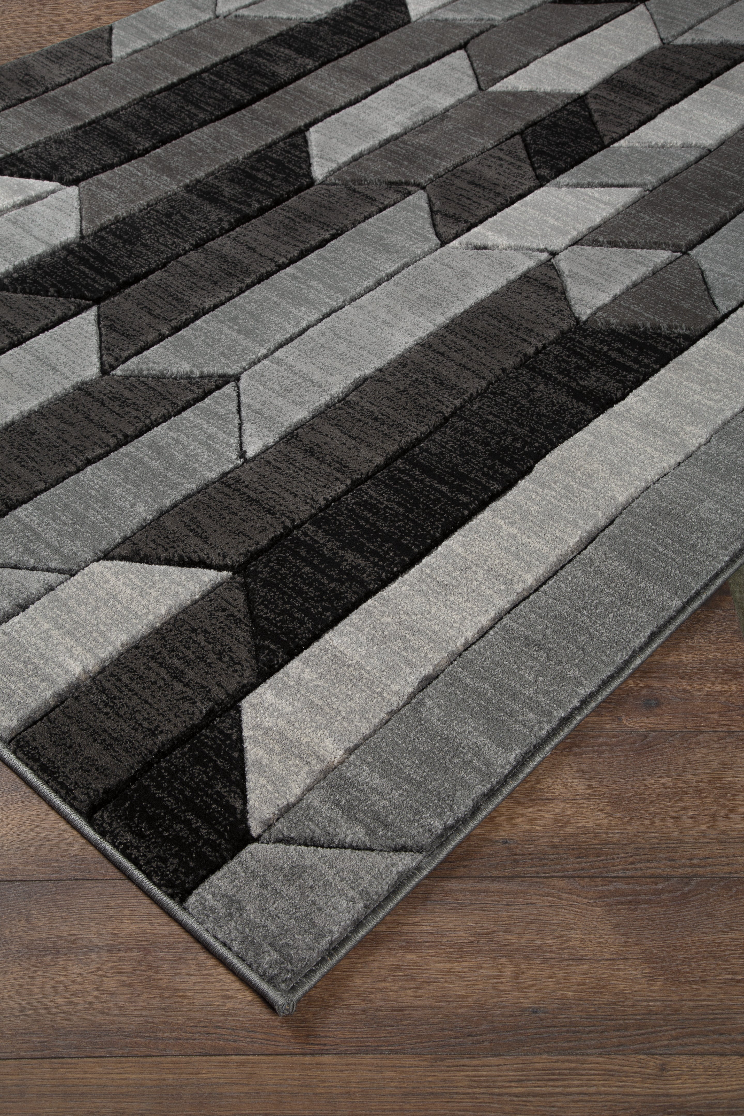 Prime Furniture - Ashley Furniture - Chayse Rug - 6'6" x 9'6" Rug / Black/Gray - R403461