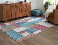 Prime Furniture - Ashley Furniture - Numore Rug - 5'2" x 6'11" Washable Rug / Multi - R406662