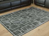 Prime Furniture - Ashley Furniture - Elderland Rug - Washable 7'6" x 9'6" Area Rug / Black/Gray - R407401