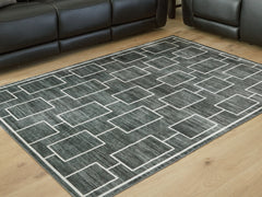 Prime Furniture - Ashley Furniture - Elderland Rug - Washable 7'6" x 9'6" Area Rug / Black/Gray - R407401