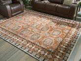 Prime Furniture - Ashley Furniture - Qaabiz Rug - 5' x 7' Area Rug / Sienna/Ivory/Black - R407522