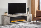 Prime Furniture - Ashley Furniture - Naydell 92" TV Stand with Electric Fireplace - 92" TV Stand with Electric Fireplace / Gray - W996W1