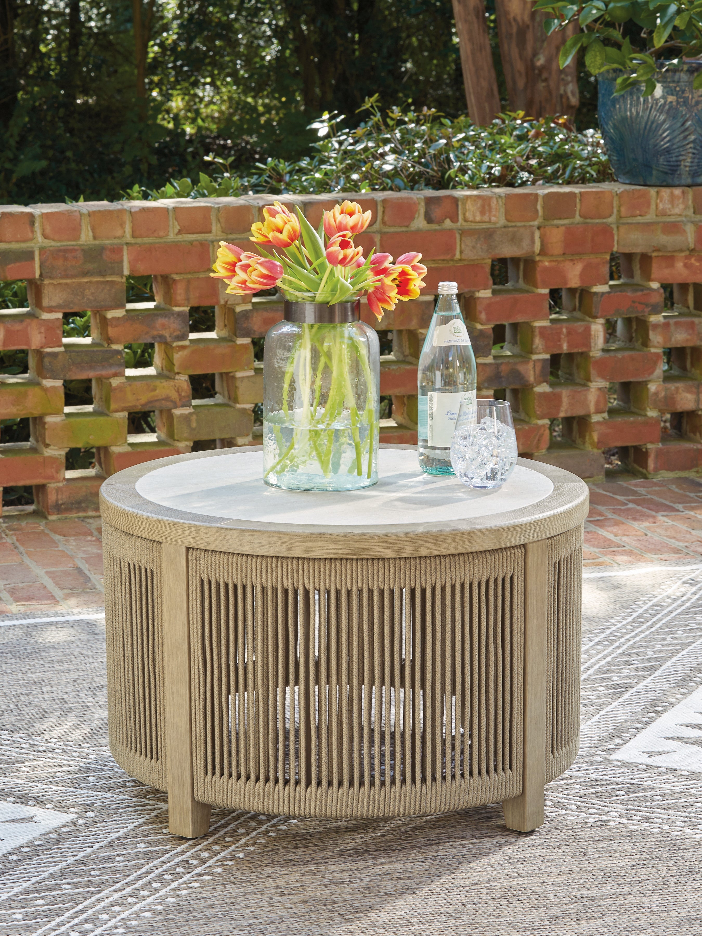 Prime Furniture - Ashley Furniture - Spooners Cove Outdoor - Round Cocktail Table / Beige - PCP469-708