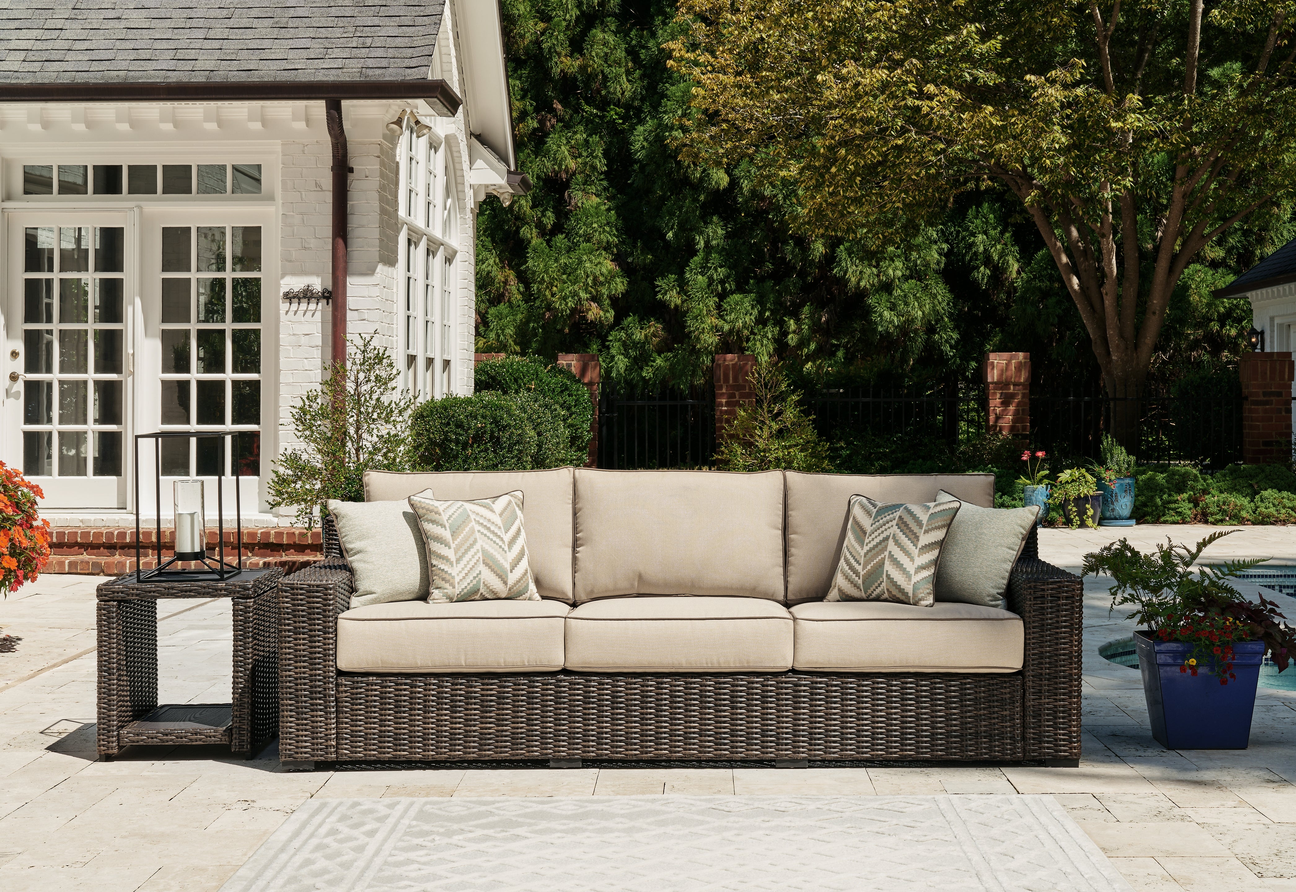 Prime Furniture - Ashley Furniture - Coastline Bay Outdoor - Sofa with Cushion / Brown - P784-838