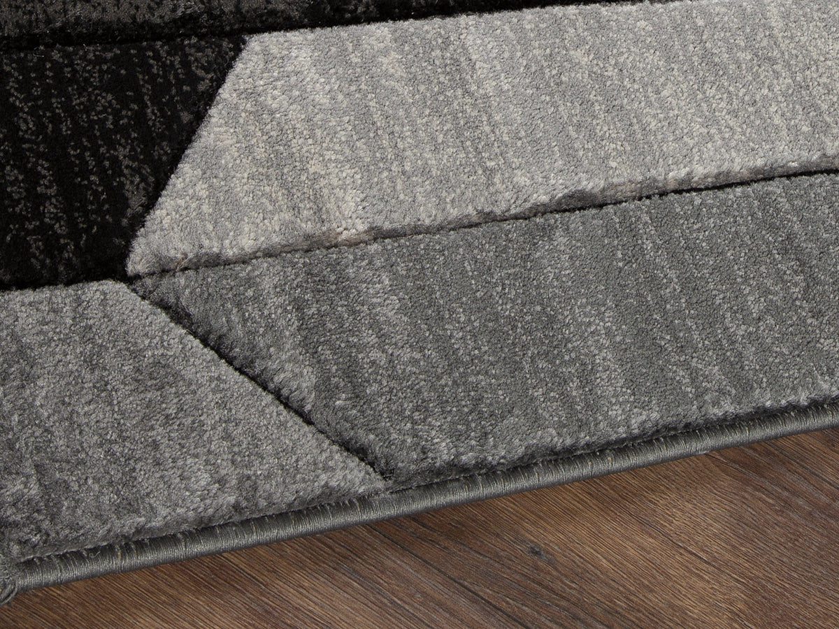 Prime Furniture - Ashley Furniture - Chayse Rug - 5' x 6'7" Rug / Black/Gray - R403462