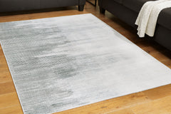 Prime Furniture - Ashley Furniture - Milset Rug - 8'1" x 10' Washable Rug / Black/White/Gray - R406251