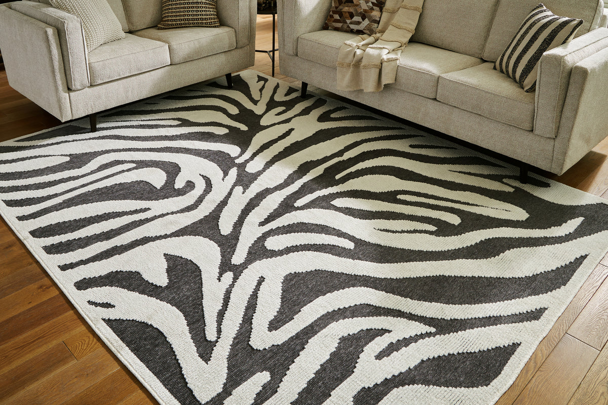 Prime Furniture - Ashley Furniture - Thomwith Rug - 8' x 10'2" Washable Rug / Black/Ivory - R406291