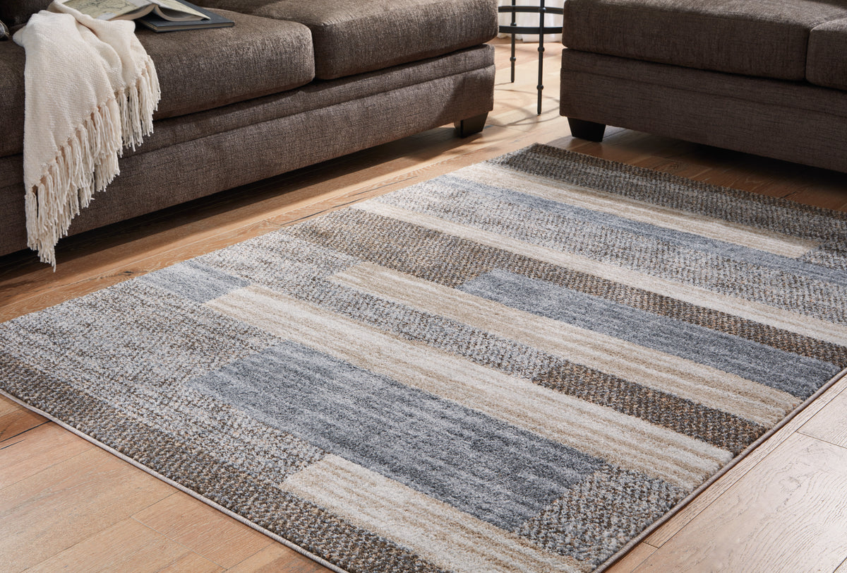 Prime Furniture - Ashley Furniture - Sethburn Rug - 5' x 7' Rug / Cream/Brown/Gray - R406592