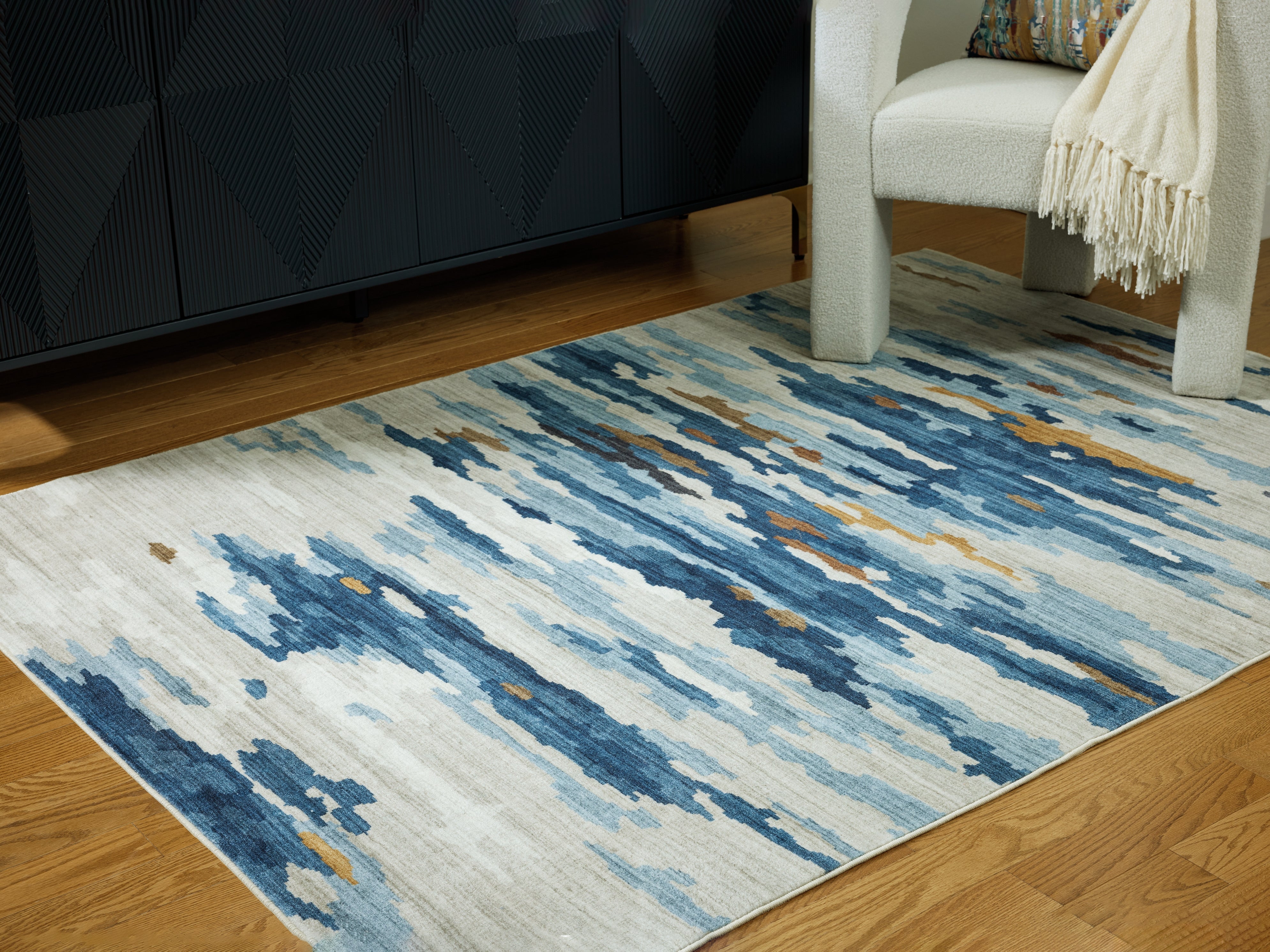Prime Furniture - Ashley Furniture - Vinlett Rug - 5' x 7' Washable Rug / Cream/Blue/Brown - R407042