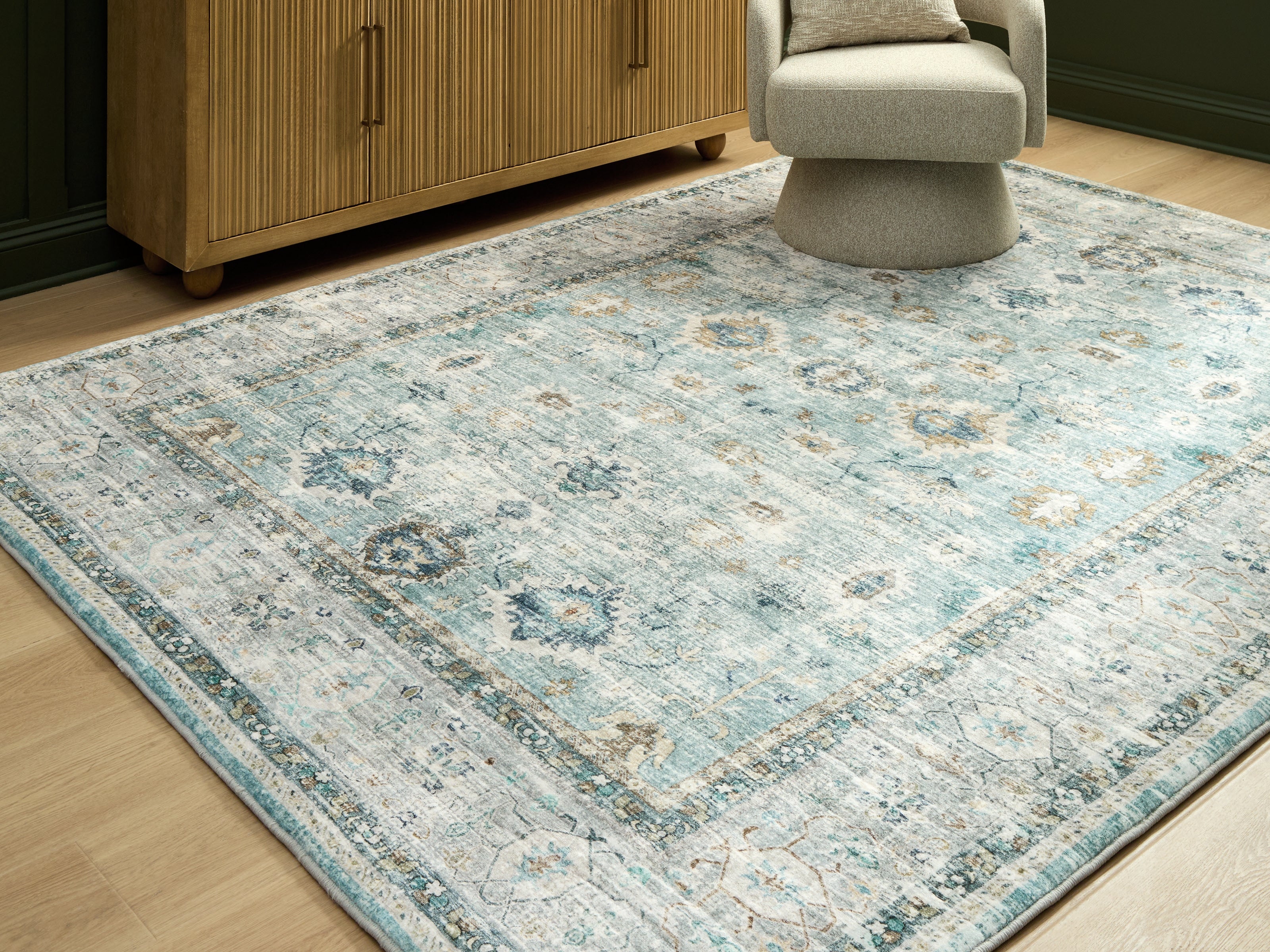 Prime Furniture - Ashley Furniture - Ladstoney Rug - 7'6" x 9'6" Area Rug / Teal/Beige/Ochre - R407501