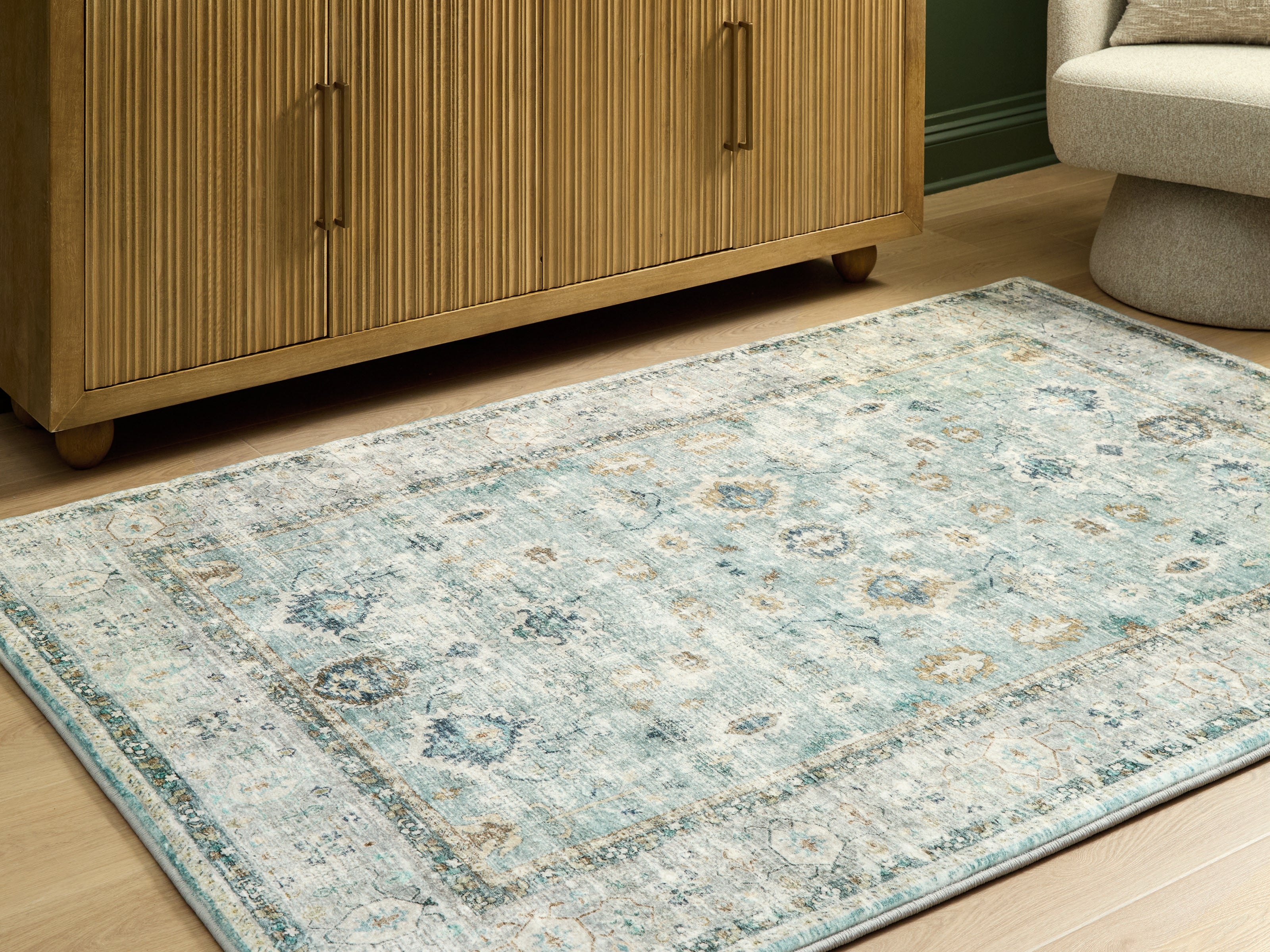 Prime Furniture - Ashley Furniture - Ladstoney Rug - 5' x 7' Area Rug / Teal/Beige/Ochre - R407502