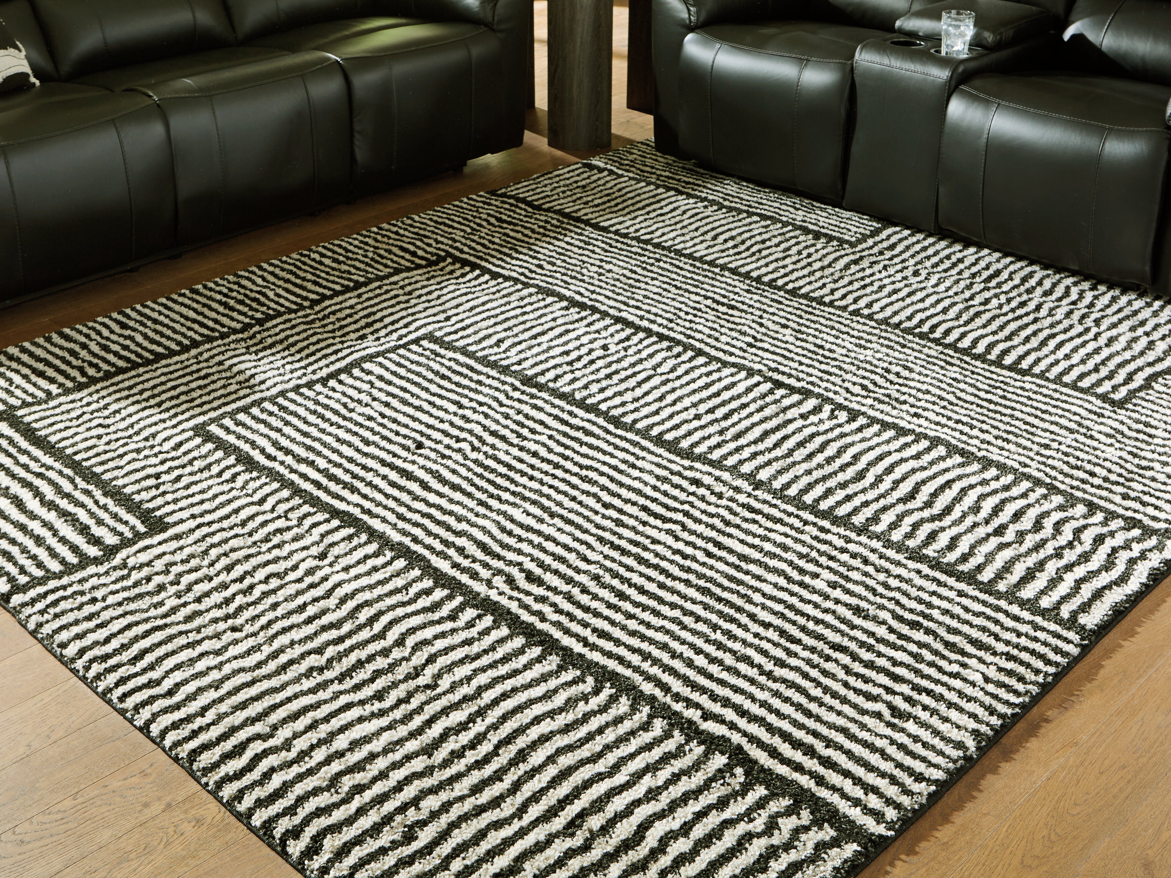 Prime Furniture - Ashley Furniture - Kurtmen Rug - 7'10" x 9'10" Area Rug / Black/Ivory - R407591