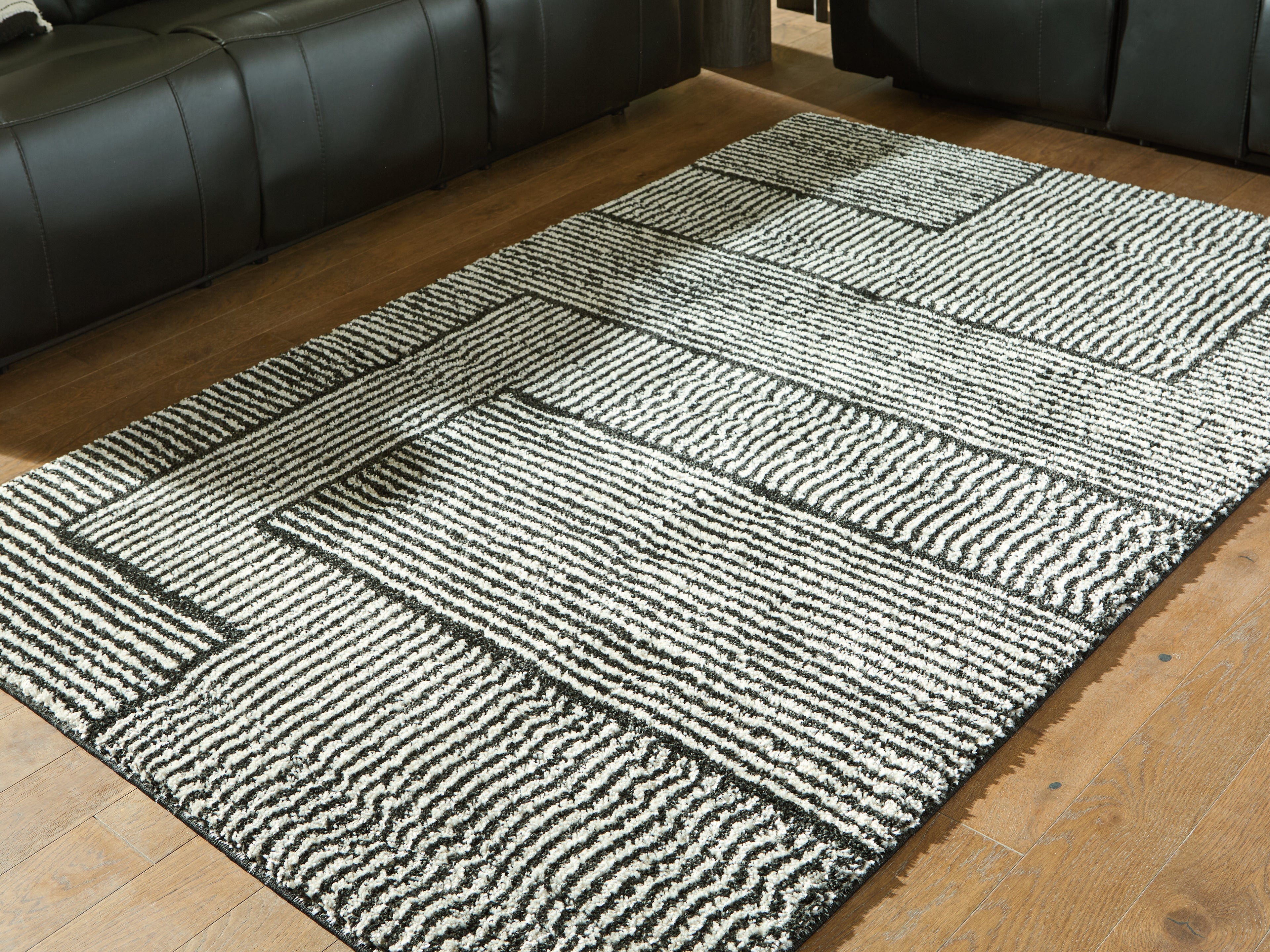 Prime Furniture - Ashley Furniture - Kurtmen Rug - 7'10" x 9'10" Area Rug / Black/Ivory - R407591