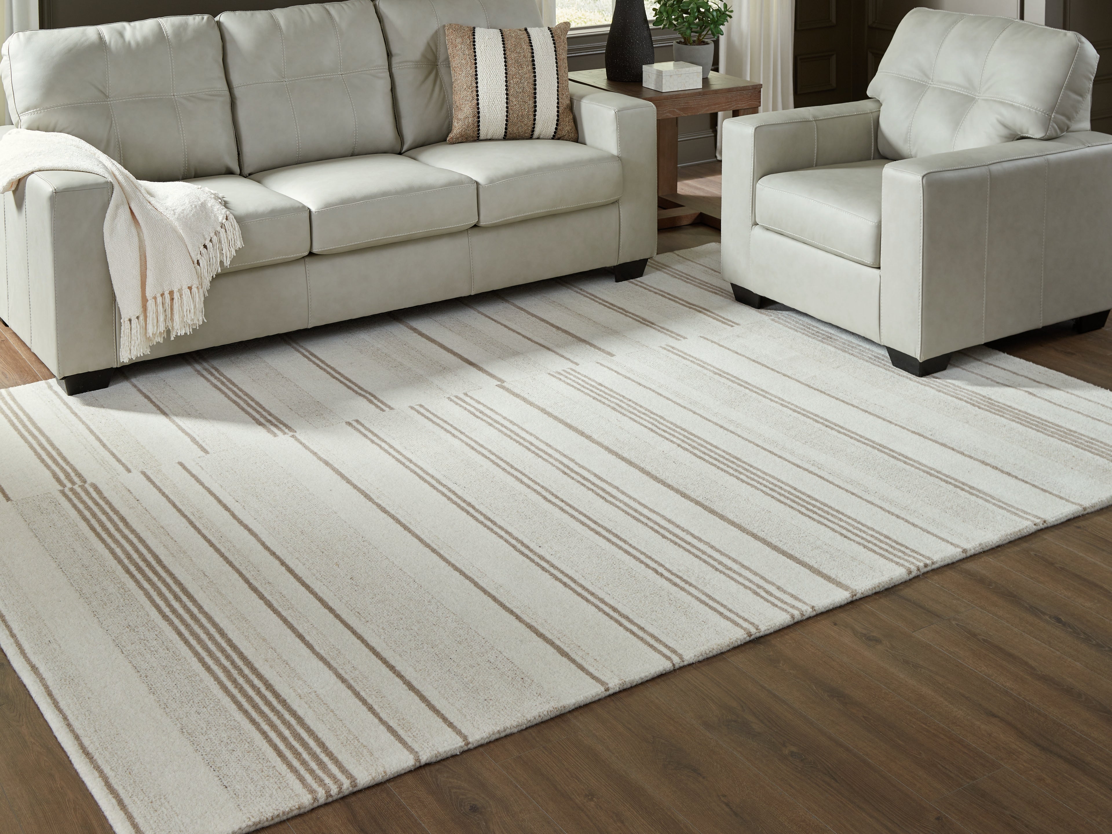 Prime Furniture - Ashley Furniture - Gadence Rug - 7'8" x 10' Area Rug / Ivory/Tan - R407641