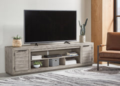 Prime Furniture - Ashley Furniture - Naydell 92" TV Stand - 92" / Gray - W996-78